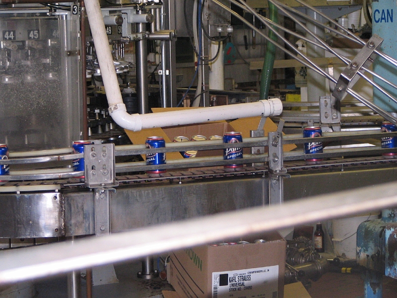 IMG_2310.jpg - Bank cans are being made for us as souvenirs.  We each received one at the end of the tour.