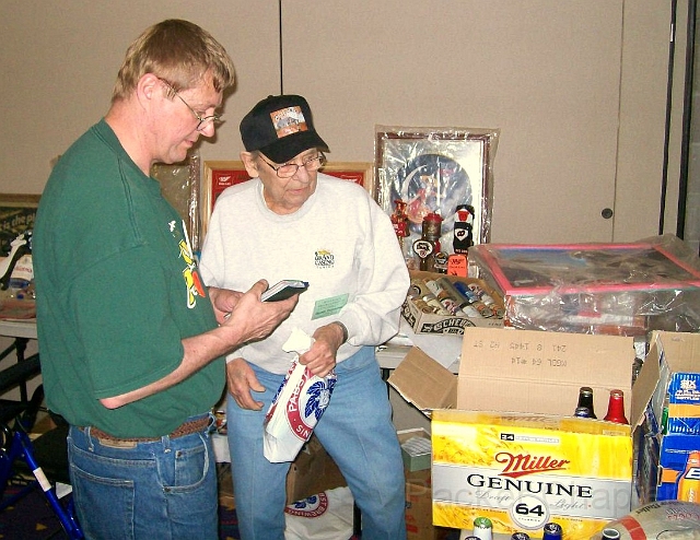 23.JPG - Gordy Durocher (in the cap) makes a deal in the “Kan Kave” Korner.